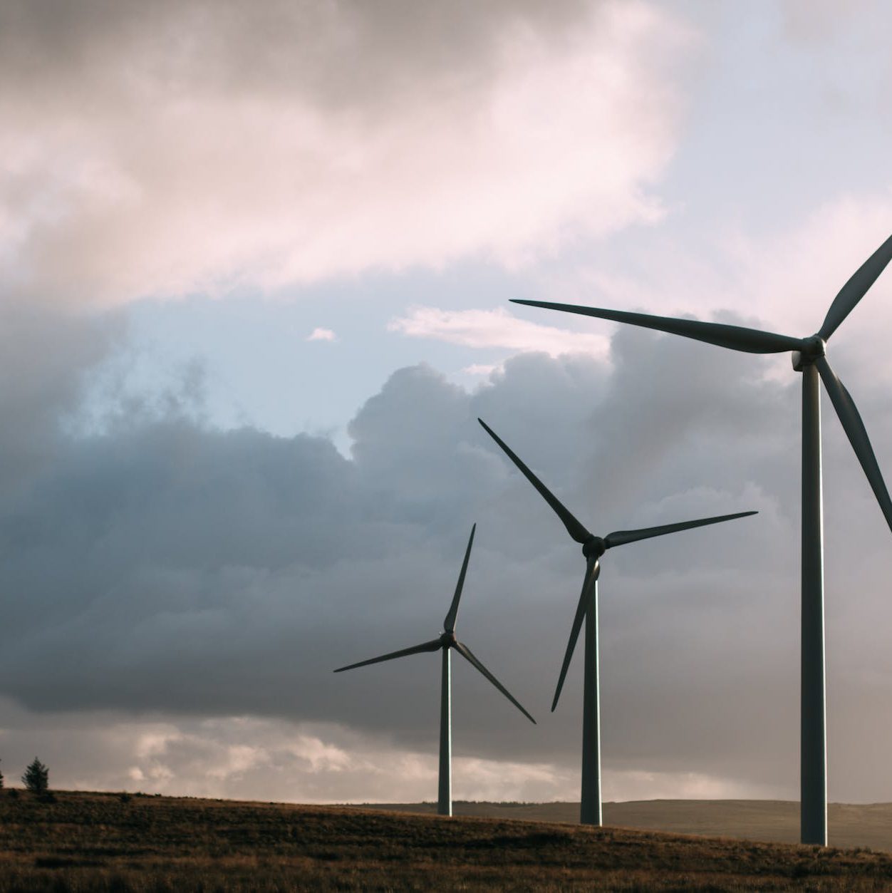 Photo by Sam Forson on <a href="https://www.pexels.com/photo/three-gray-wind-turbine-243138/" rel="nofollow">Pexels.com</a>