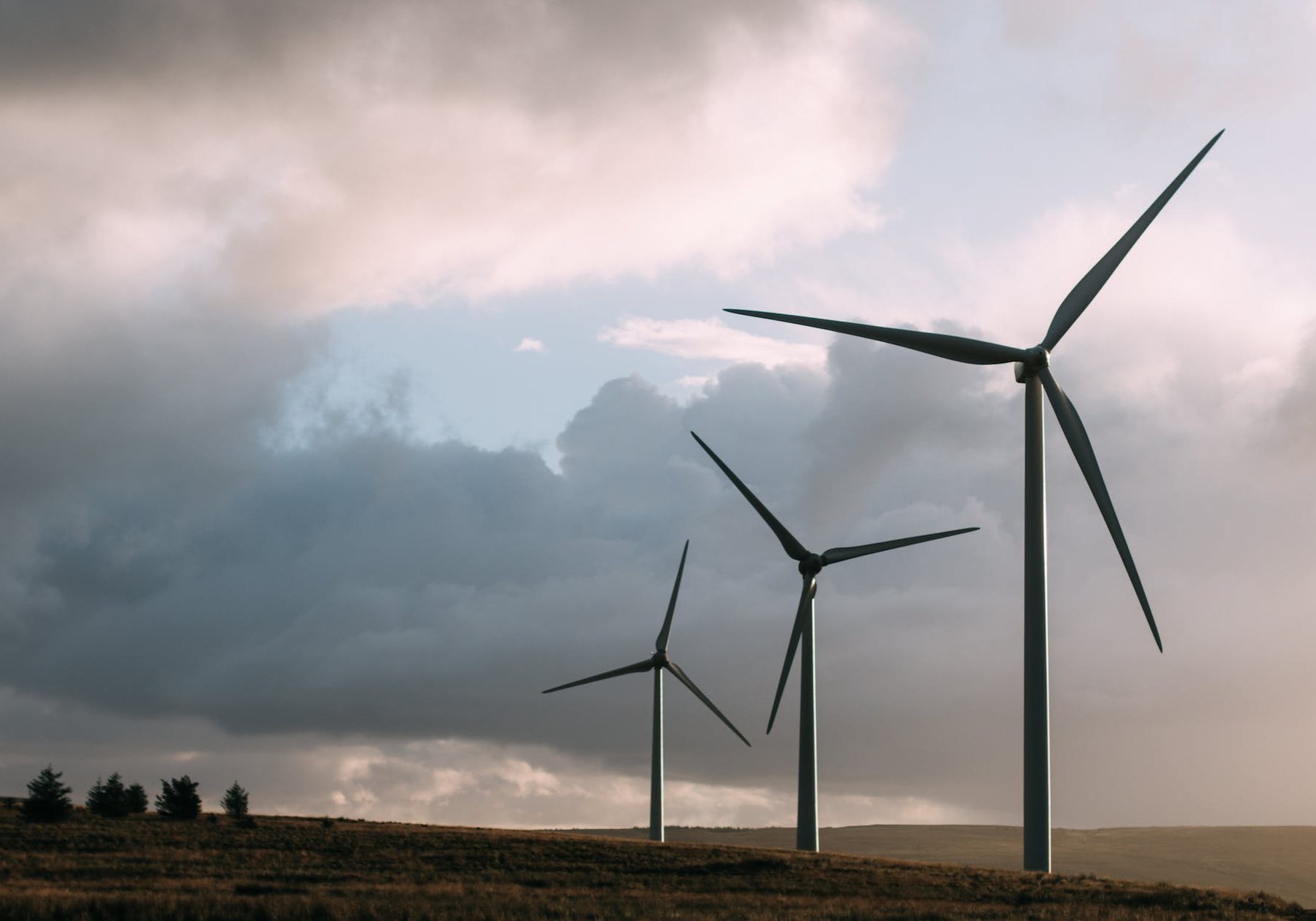 Photo by Sam Forson on <a href="https://www.pexels.com/photo/three-gray-wind-turbine-243138/" rel="nofollow">Pexels.com</a>